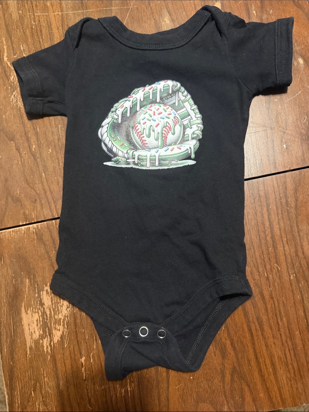 Bella Canvas Black Baby Bodysuit with Green Drip Baseball Graphic